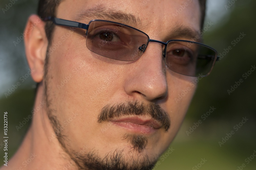 Close-up of transition lenses changing tint in sunligh